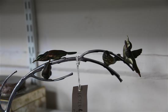 A French Art Deco silvered and painted bronze figure group, modelled as four humming birds, 13.75in.